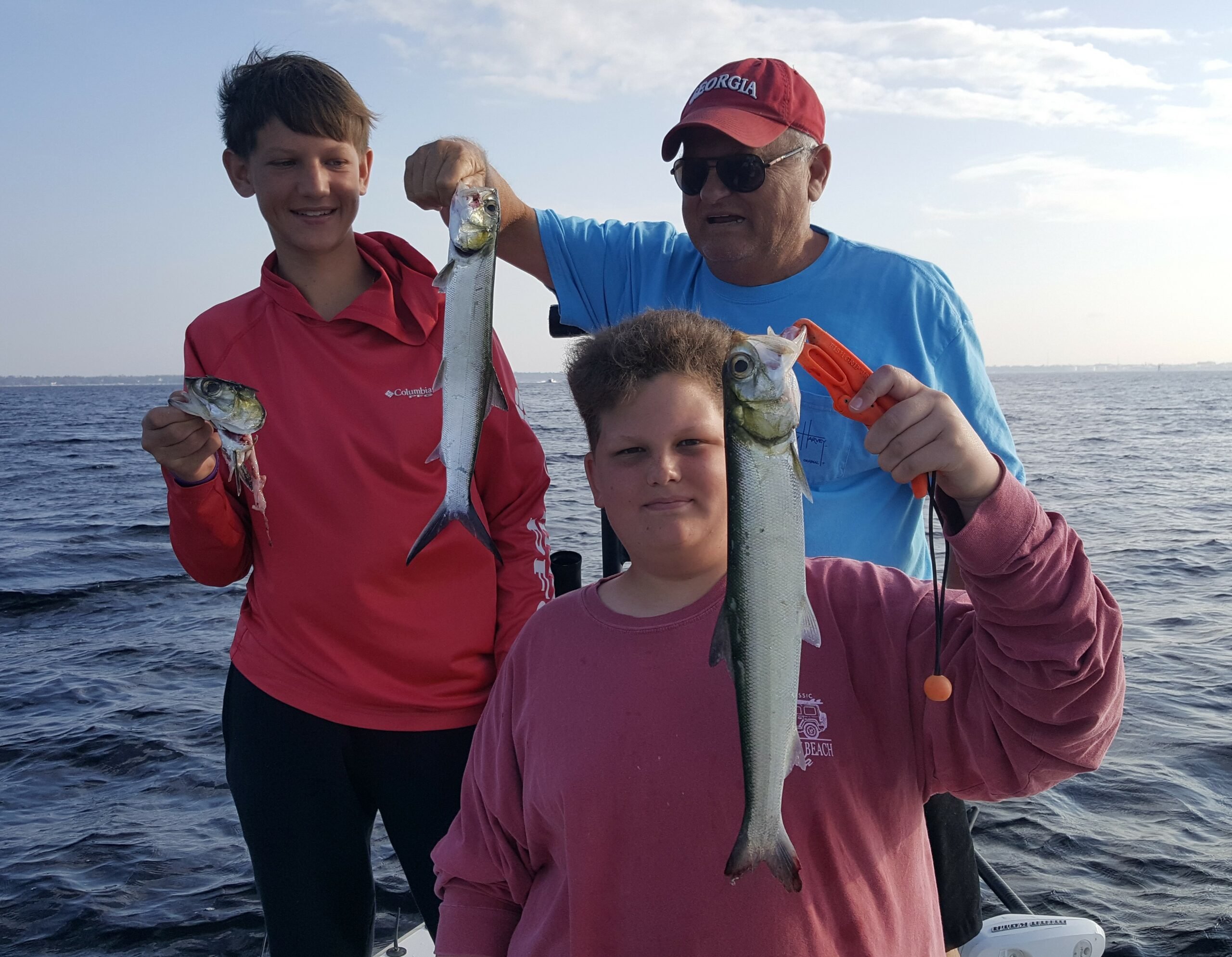 Lady Fishing catch charter fishing client holding a fish and getting some Lady Fishing in at panama city