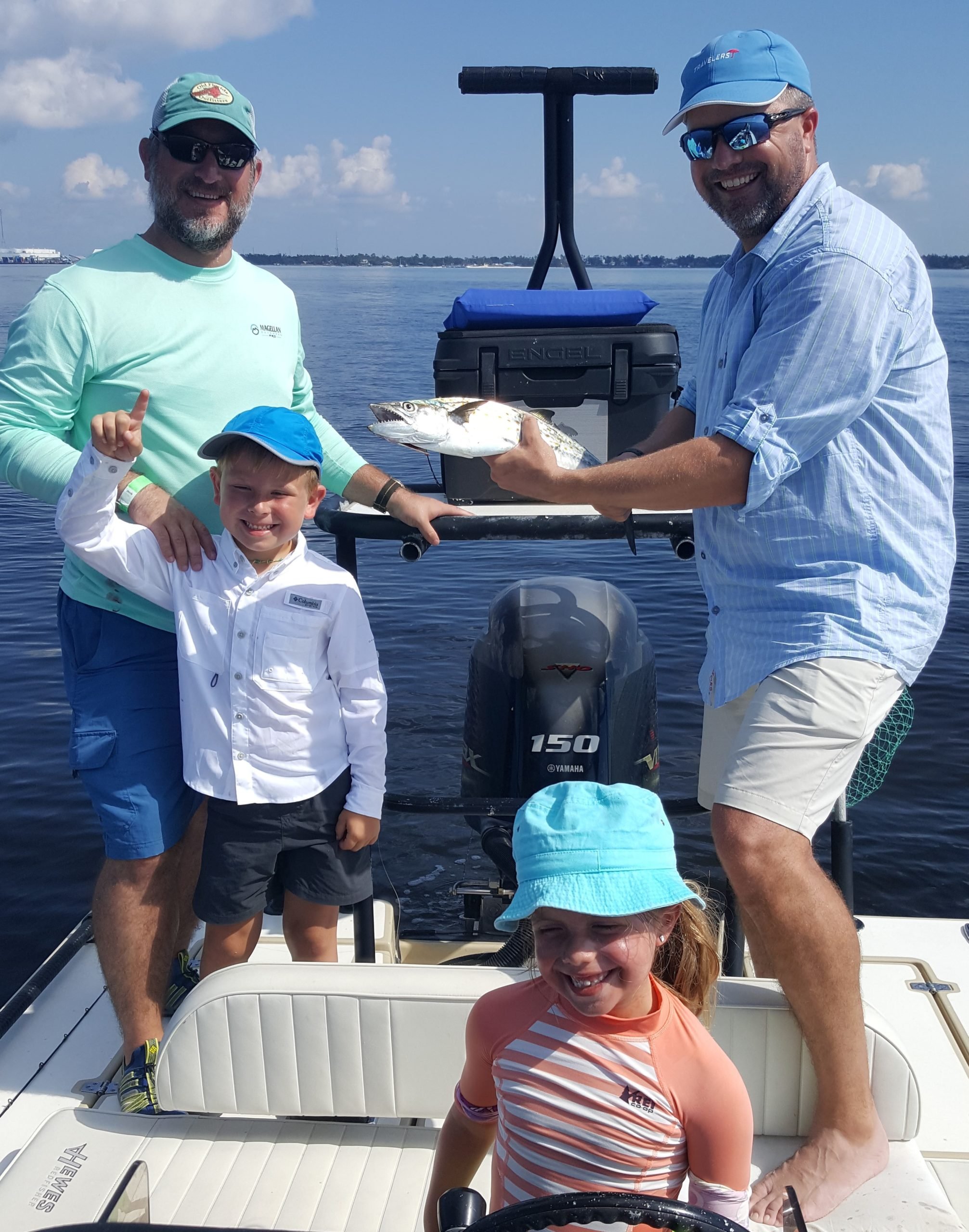 Spanish Mackerel Fishing catch charter fishing client holding a fish and getting some Spanish Mackerel Fishing in at panama city