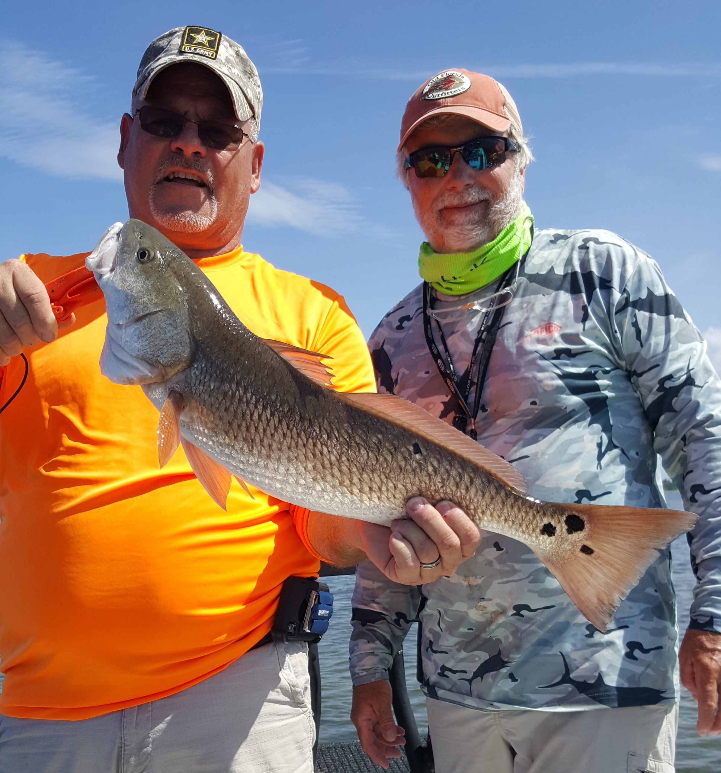Spring Fishing catch charter fishing client holding a fish and getting some Spring Fishing in at panama city