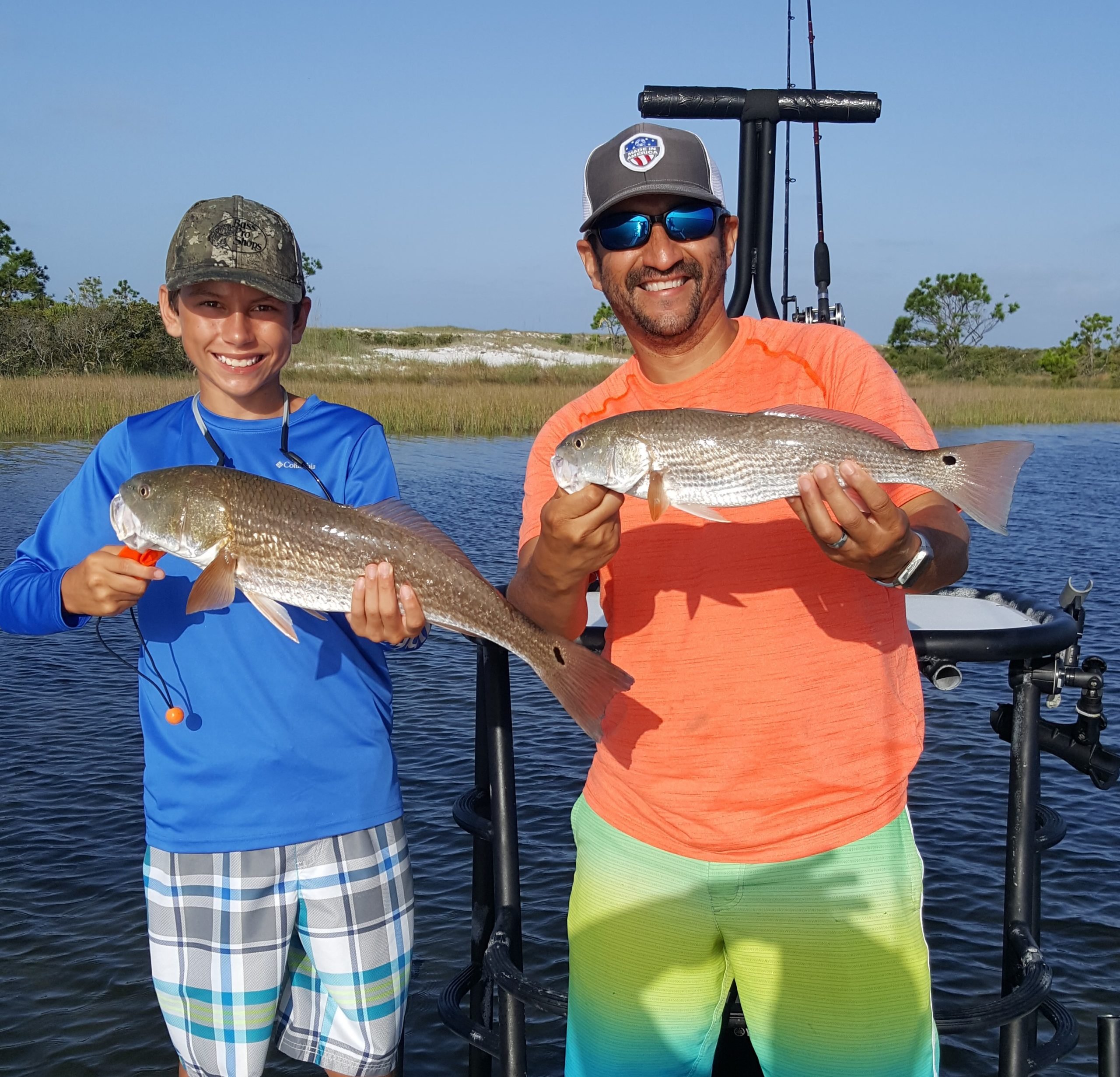 Summer Fishing catch charter fishing client holding a fish and getting some Summer Fishing in at panama city