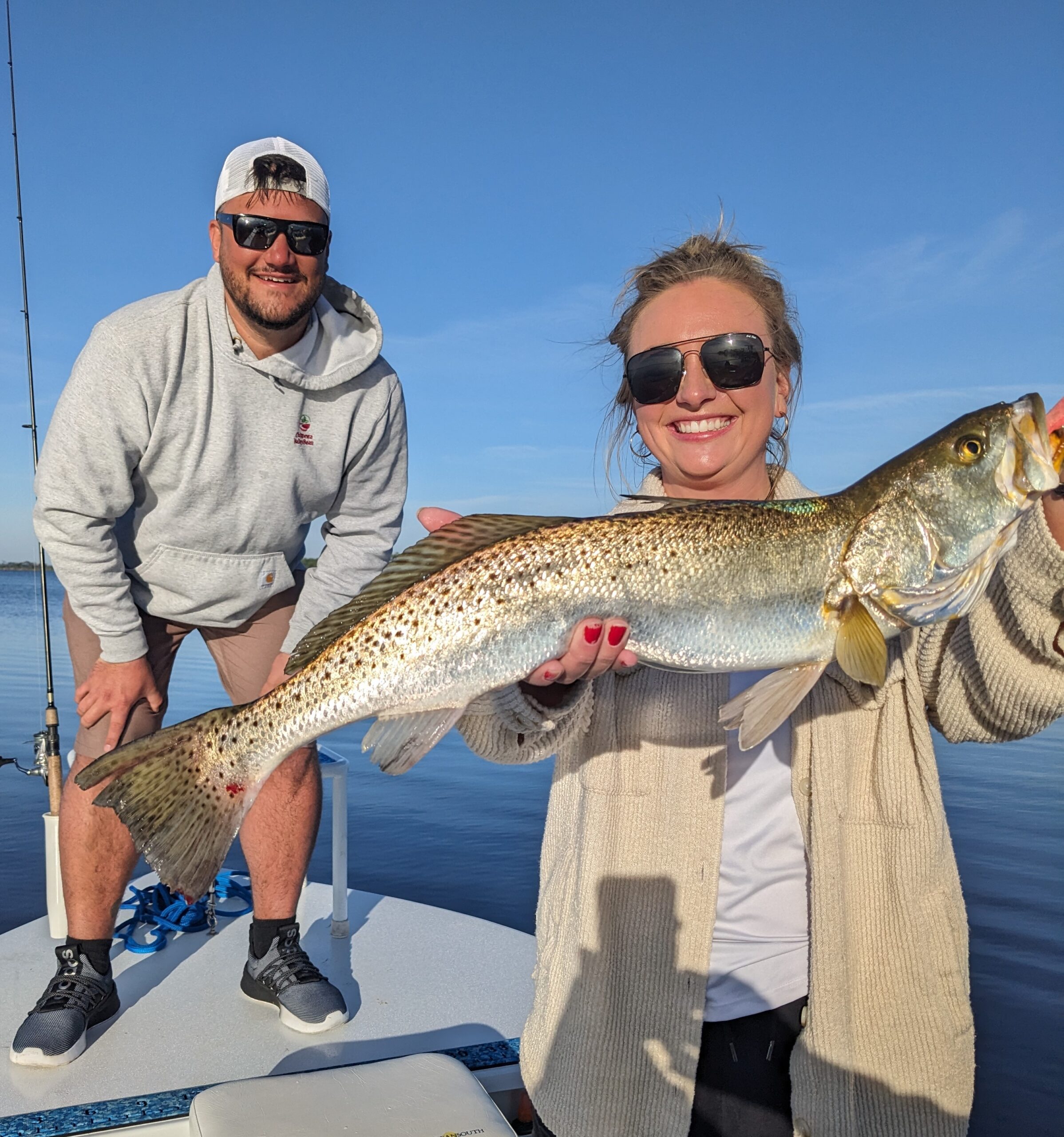 Trout Fishing catch charter fishing client holding a fish and getting some Trout Fishing in at panama city